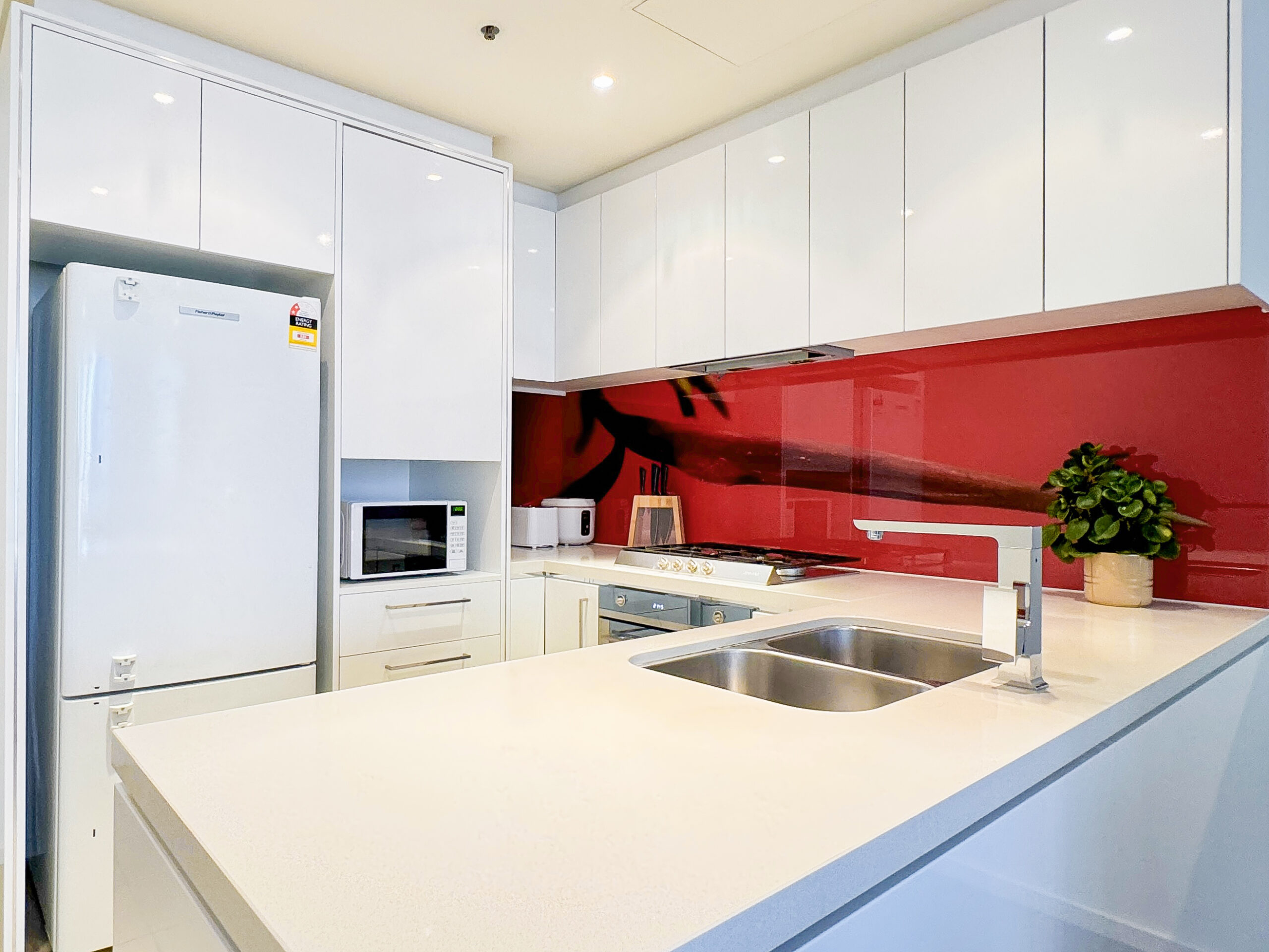 Kitchen with a red backdrop